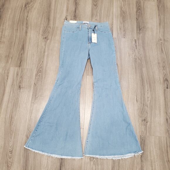 Judy Blue Denim - #466. Judy Blue Light Wash Flare Jeans with Raw Hem.